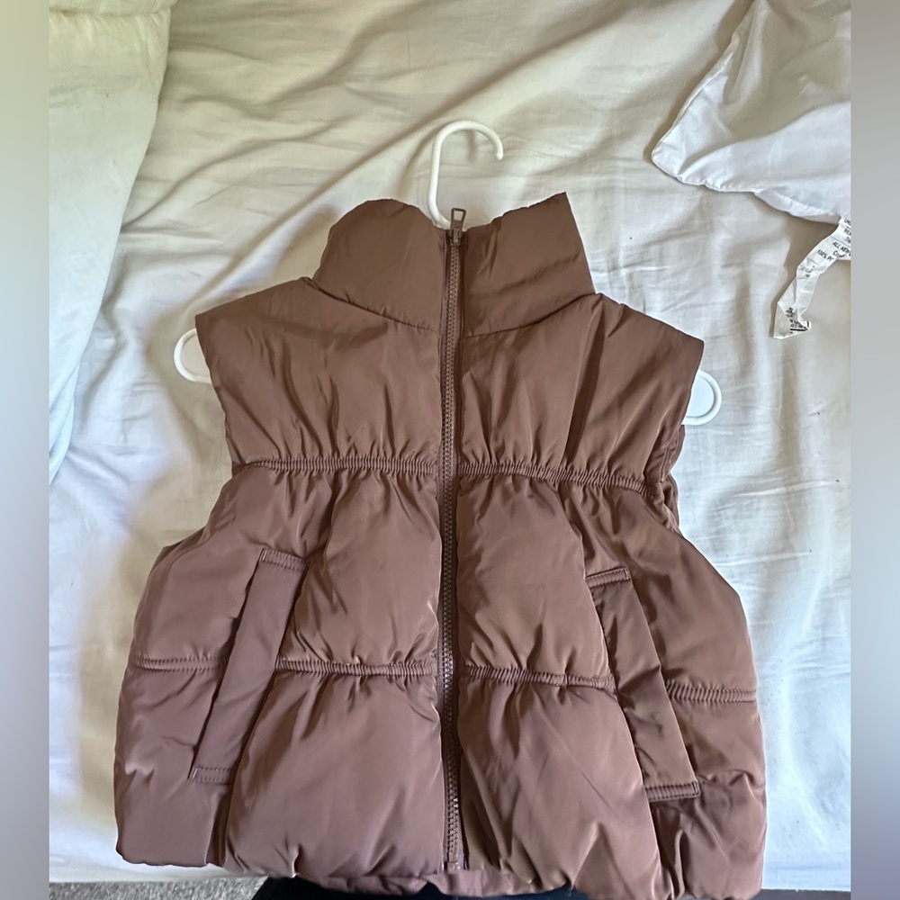 Divided brown vest